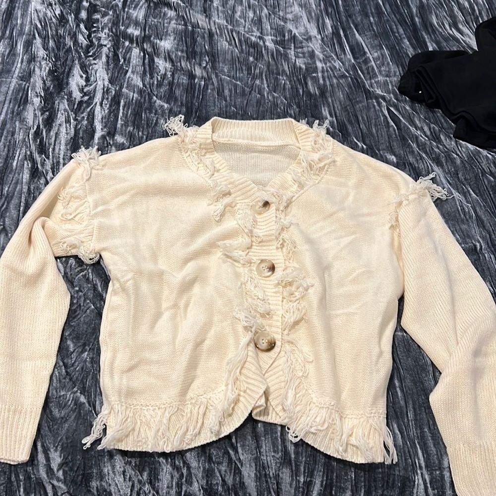 Cream colored cardigan with fringe